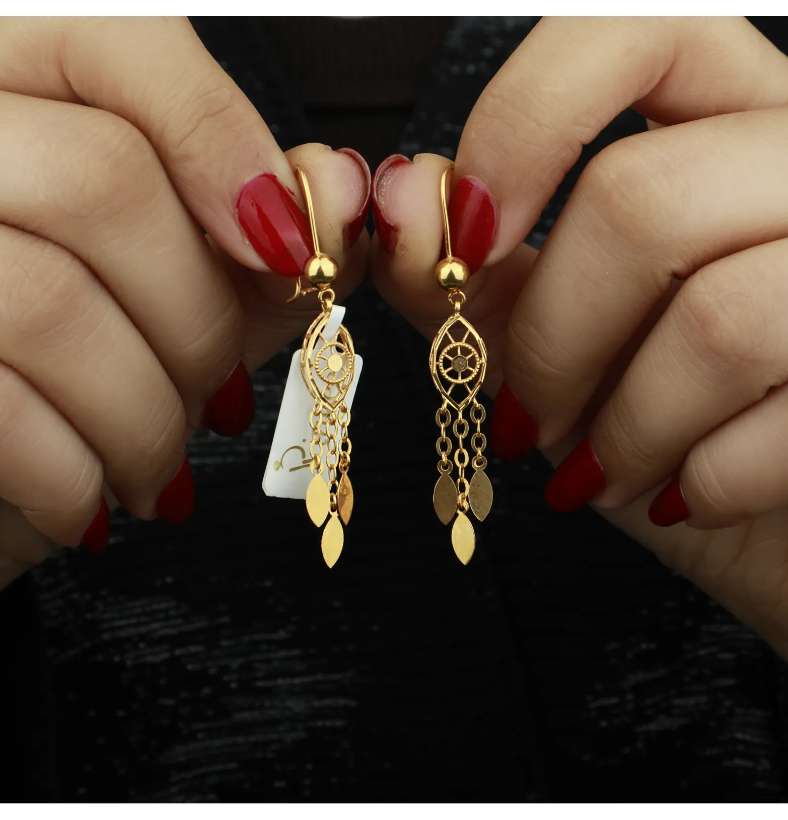 21-karat gold earrings, made in Kuwait