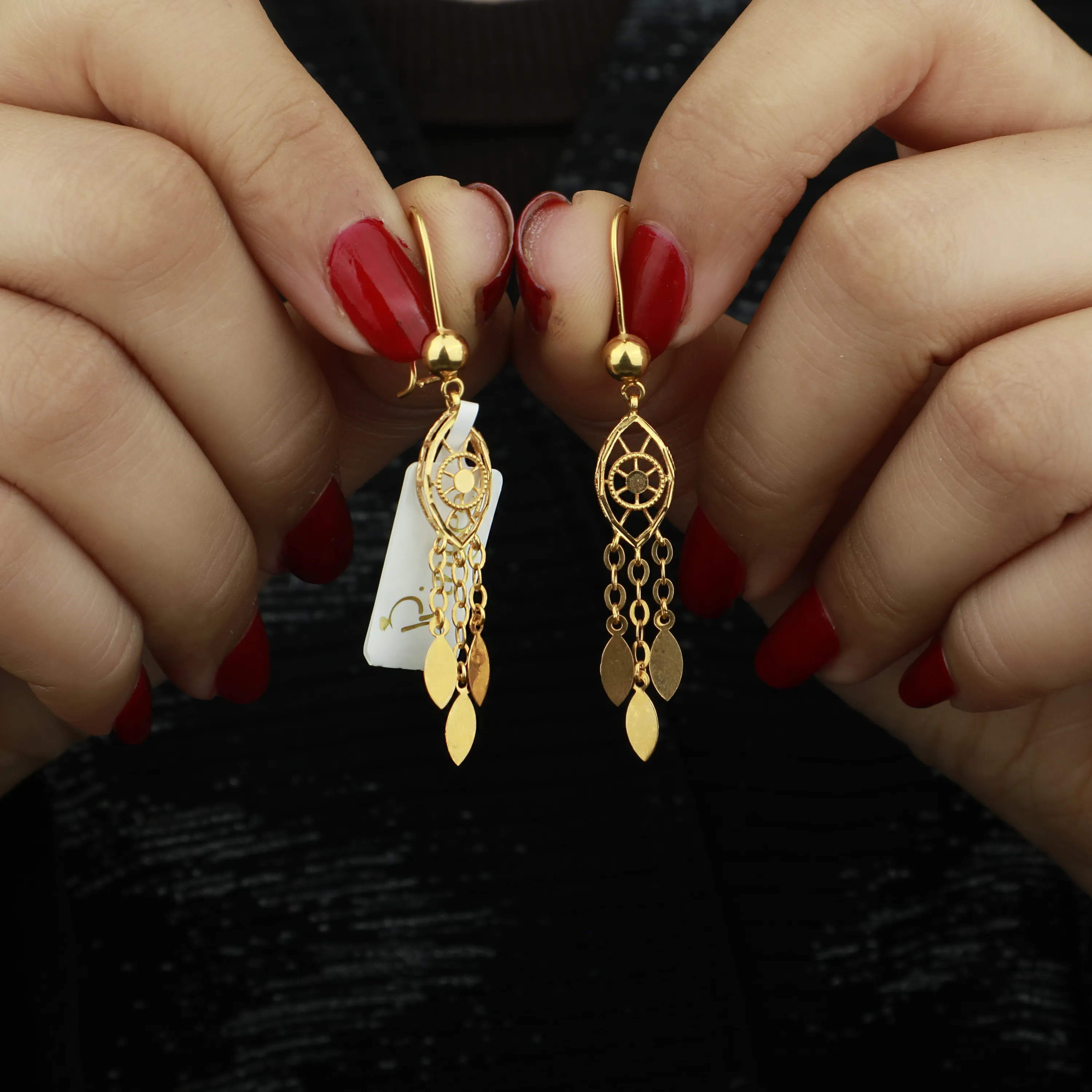 21-karat gold earrings, made in Kuwait