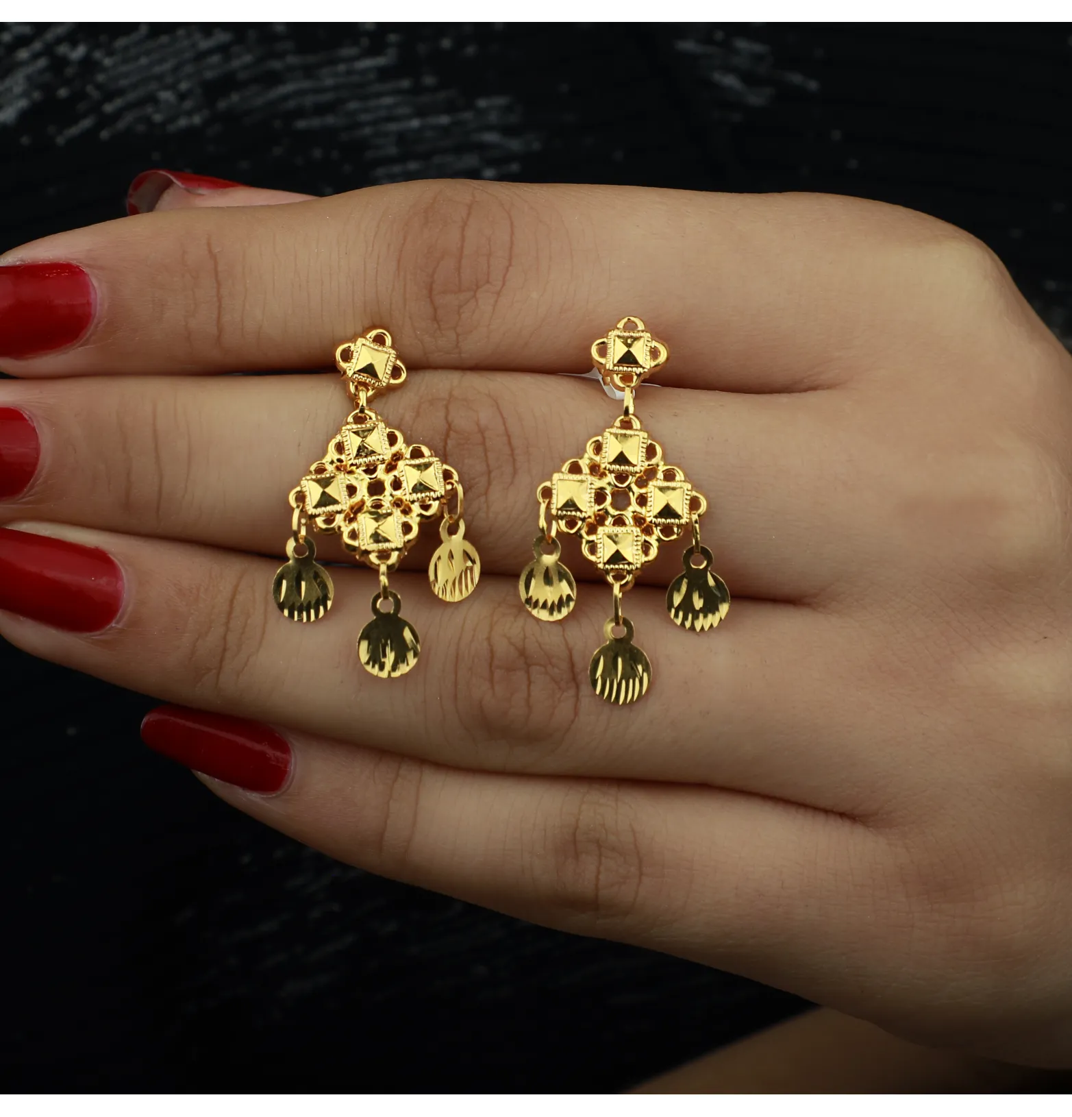 21-karat gold earrings, made in Singapore