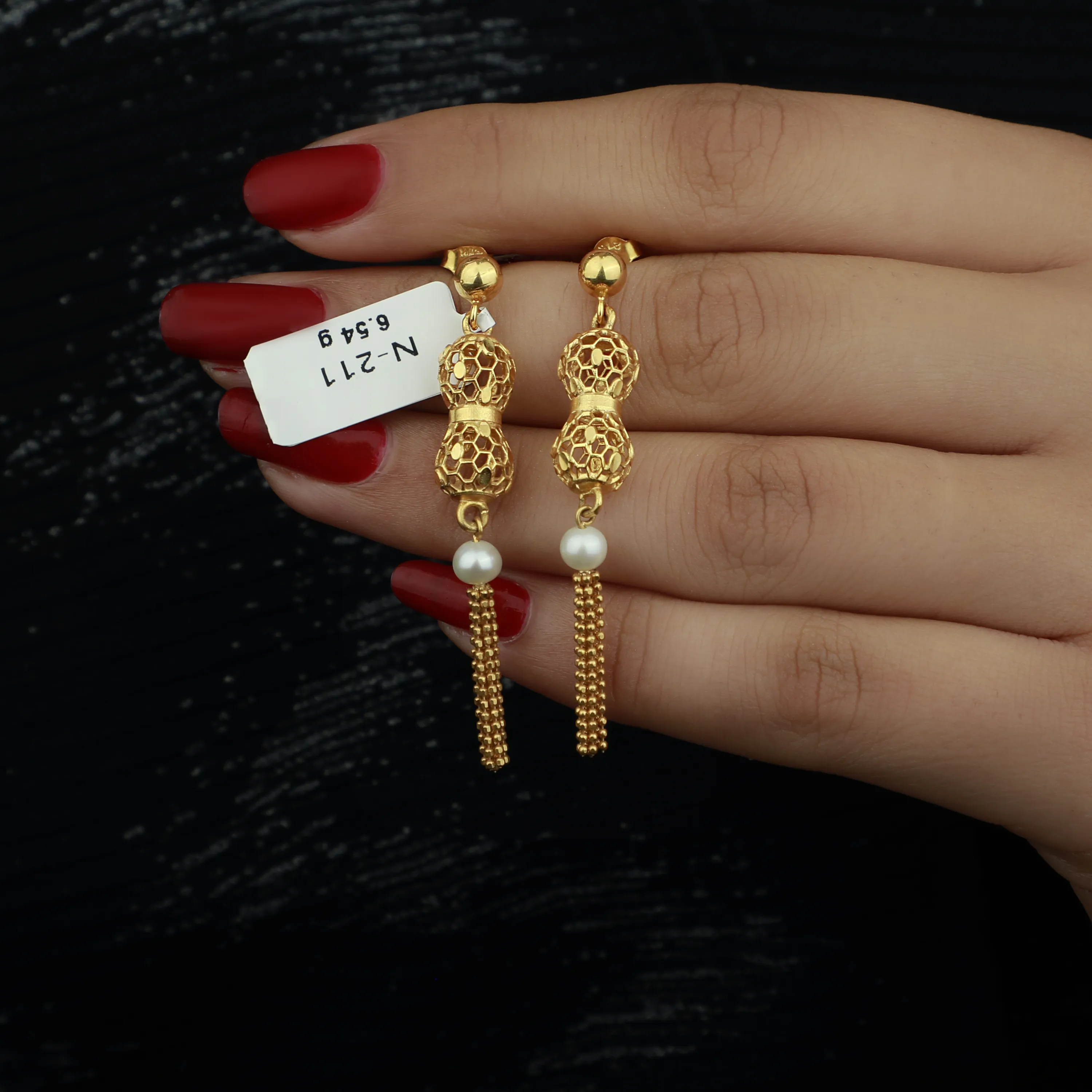 21-karat gold earrings, made in Singapore