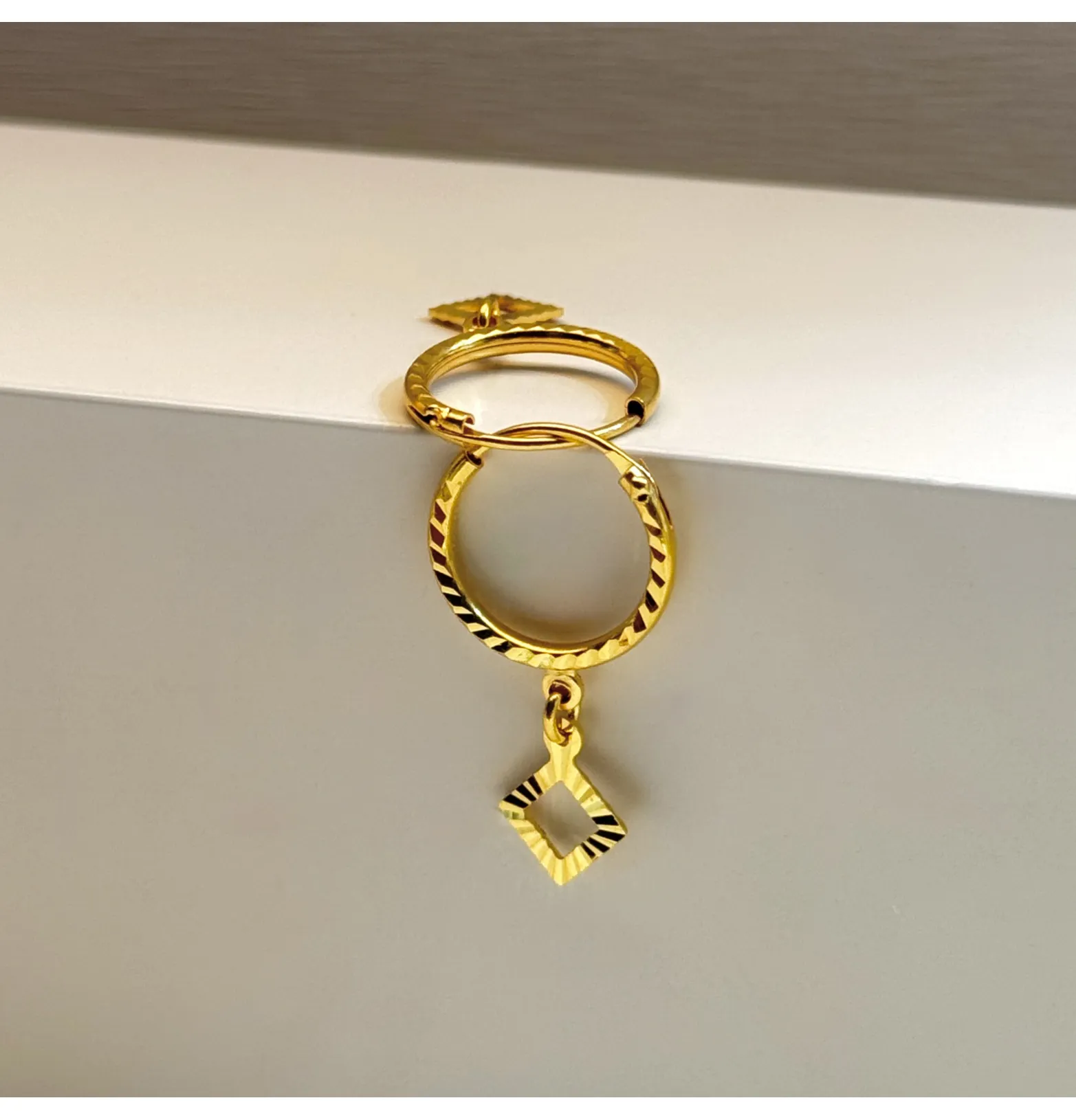 21-karat gold hoop earrings for children, Omani-made