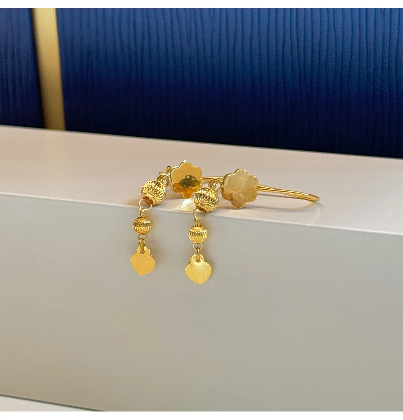 21-karat gold pendant earrings, made in Singapore