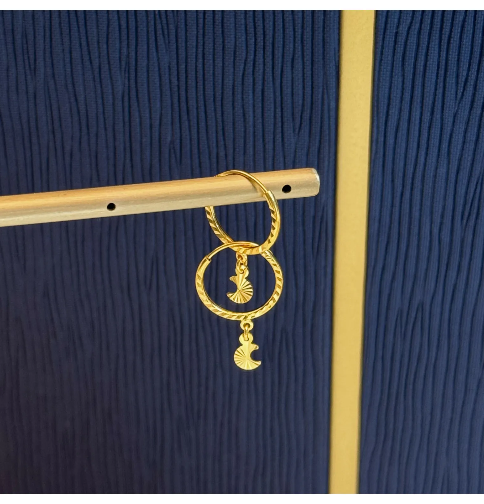 21-karat gold hoop earrings, made in the UAE