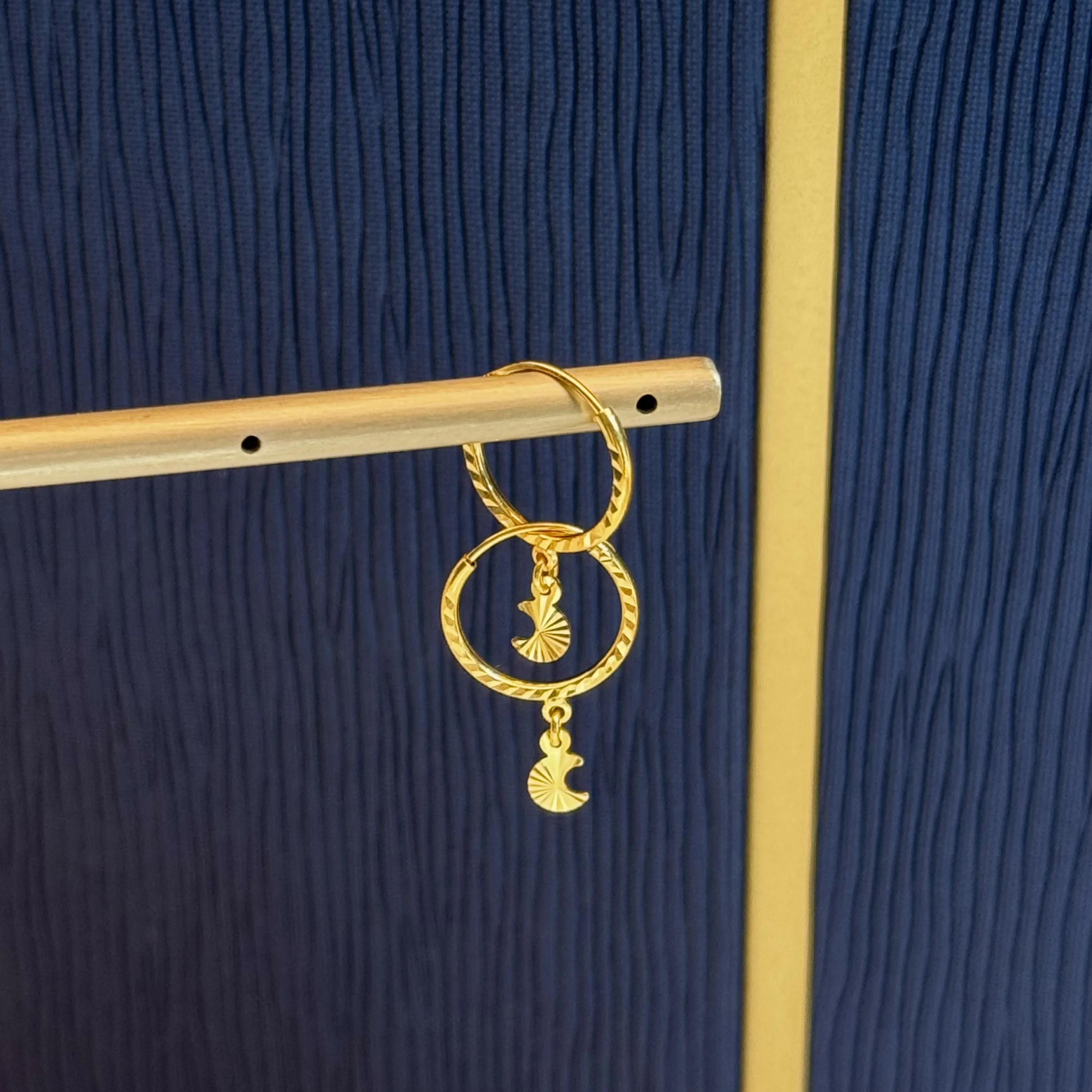 21-karat gold hoop earrings, made in the UAE