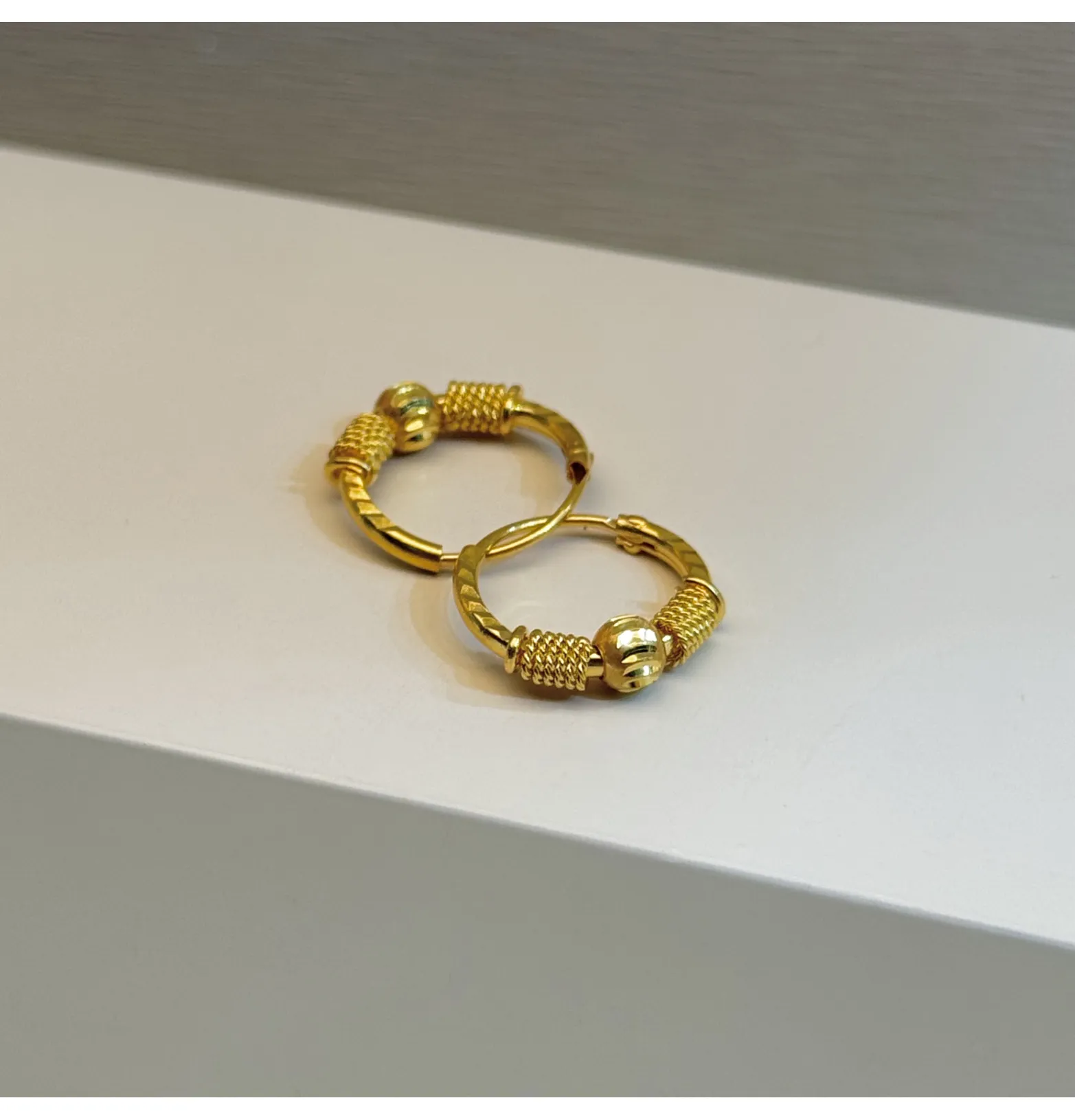 21-karat gold hoop earrings for children, made in the UAE