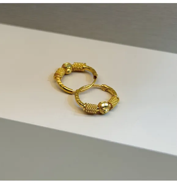 21-karat gold hoop earrings for children, made in the UAE