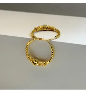 21-karat gold hoop earrings, made in the UAE