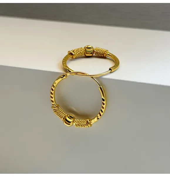 21-karat gold hoop earrings, made in the UAE